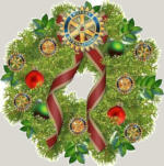 A Christmas wreath with a Rotary wheel at the top
